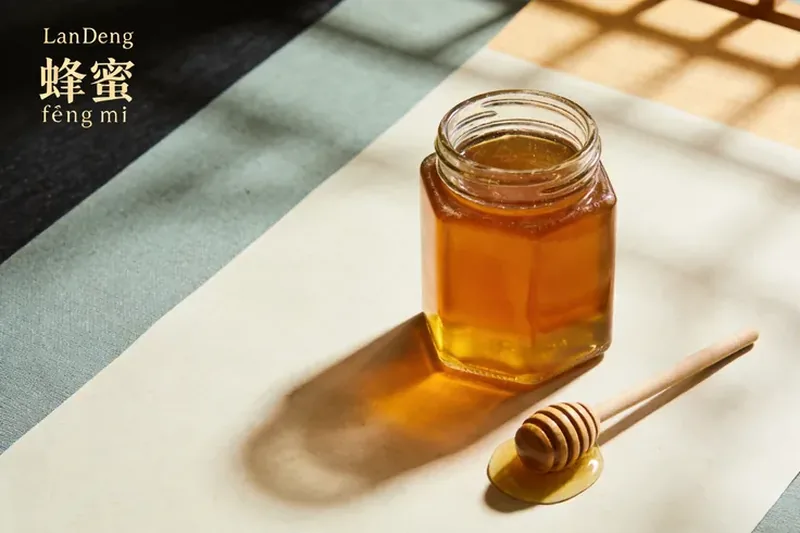 Raw Honey (Apis mellifera (honey bee) — bee product, not botanical) material, editorial still life